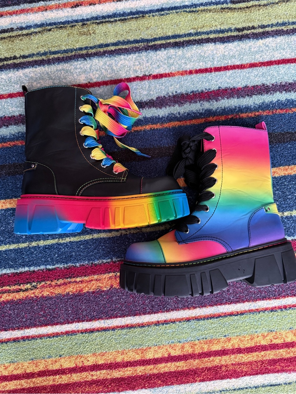 Mismatched rainbow combat boots.